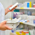 Pharmacist gathering medications