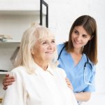 Happy Nurse helping patient